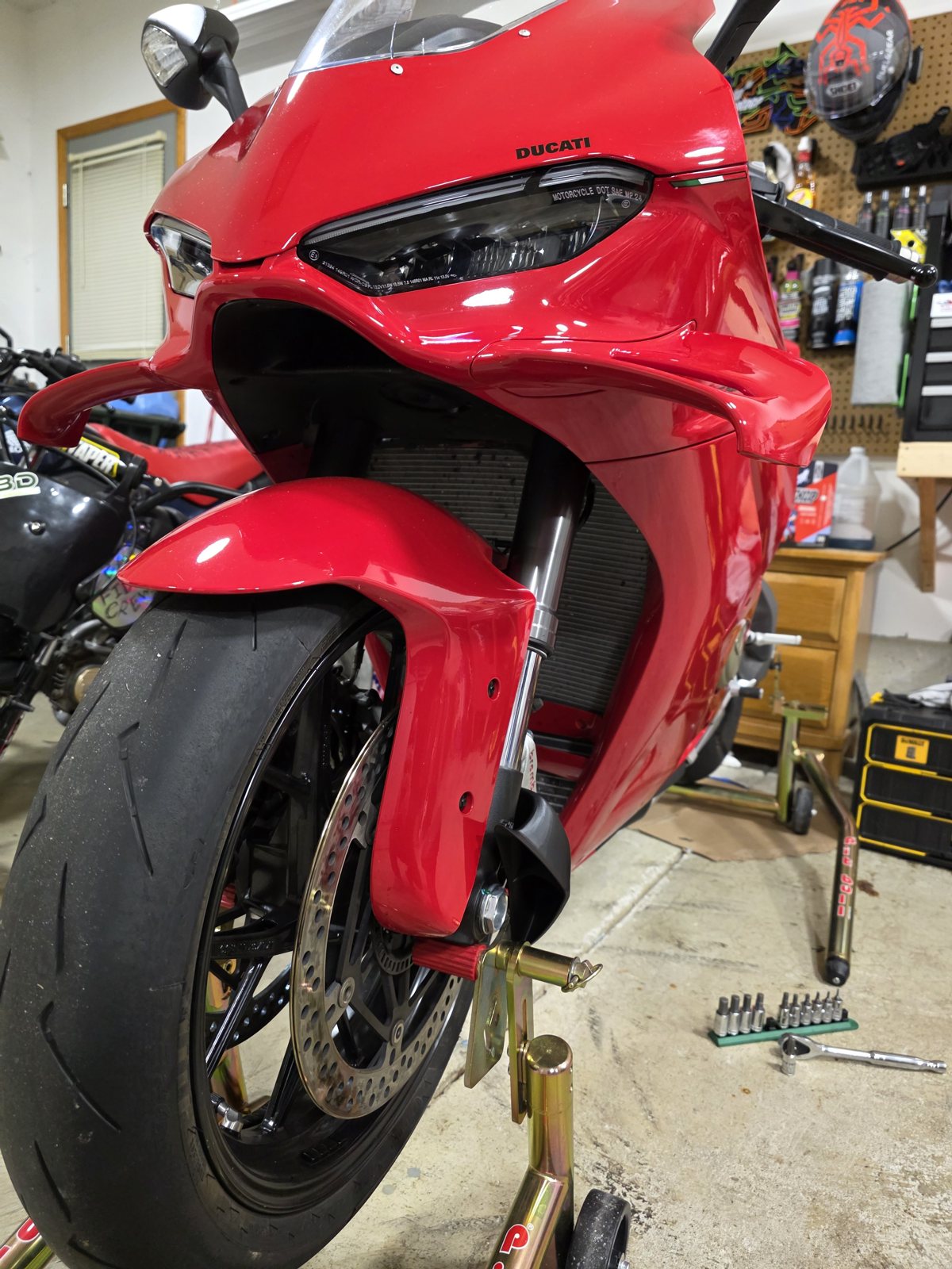 Front three-quarter: scoop mouth below the fender