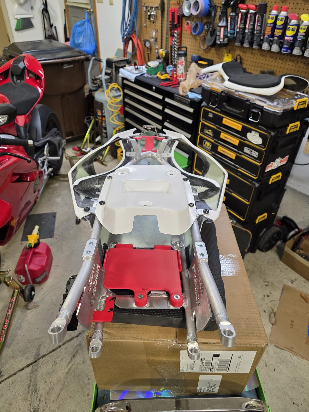 Top of the subframe, ECU plate between the bottom rails