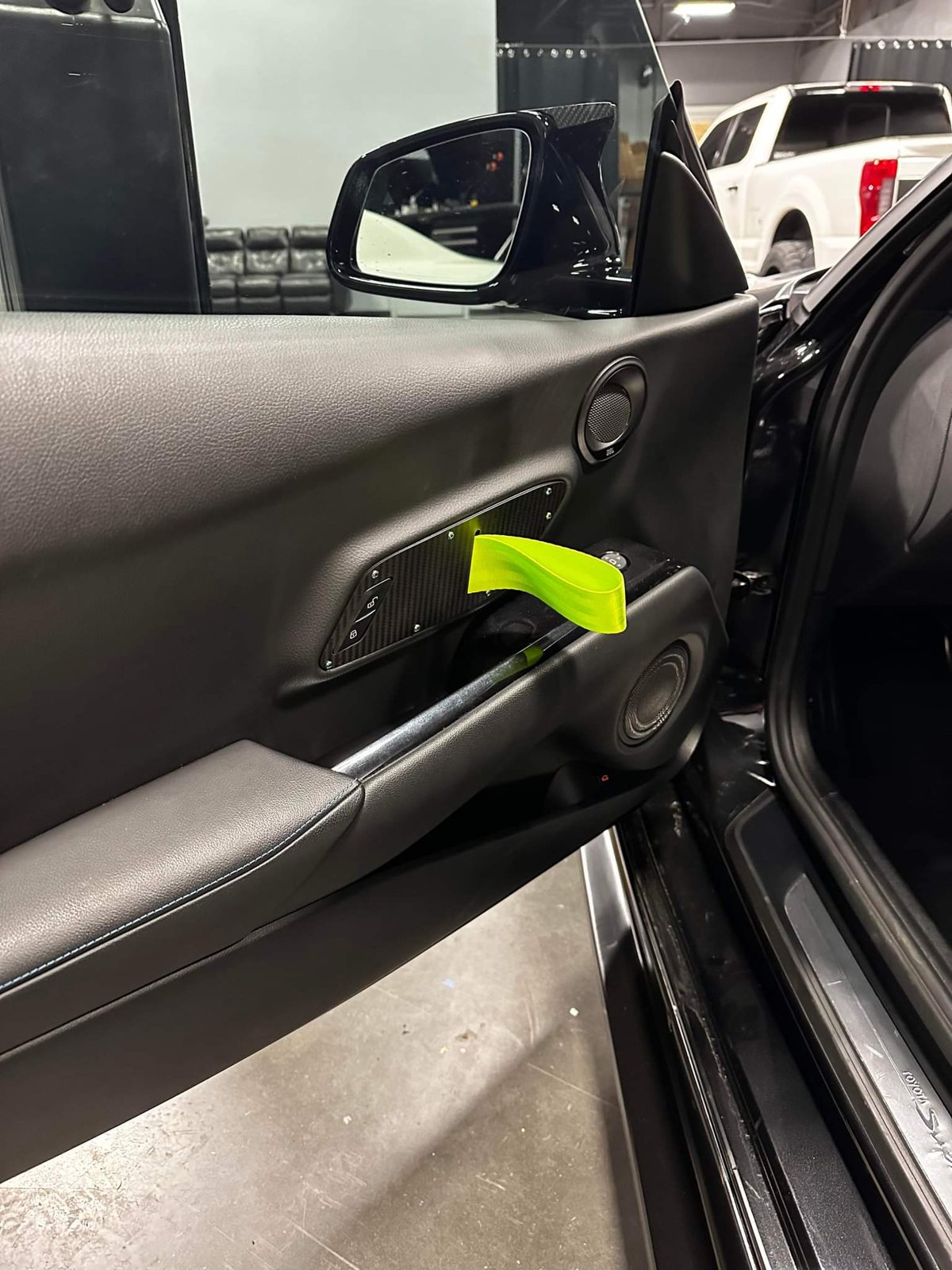 Supra GT door pull with a lime strap