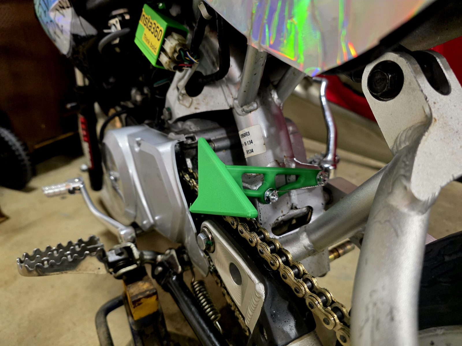 The original printed chain guard installed on the XR50